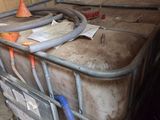 a large metal container with a hose on top of it