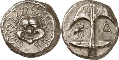 a silver coin with an image of a man on it