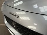 a close up of a car ' s hood with a logo on it
