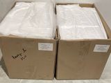 two boxes that are sitting next to each other on the floor