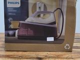 packaging of a philips steam iron sitting on a wooden table