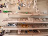 many shelves with various items on them in a store