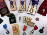 many medals and medals on display on a table