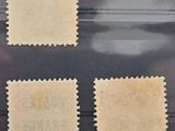 four different stamps on a black surface, one with a stamp on it