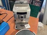 a coffee machine that is sitting on a table