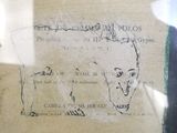 a drawing of a man ' s face on a piece of paper
