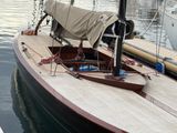a sail boat that is docked in the water