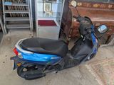 a scooter that is parked in a garage