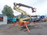 a crane that is sitting in the middle of a parking lot