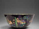 an image of a black and purple bowl with a painting on it