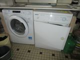 a washer and a dryer sitting in a kitchen