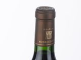 a bottle of wine that is sitting on a table