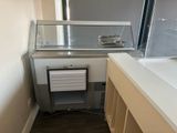 an image of a kitchen with a sink and a freezer