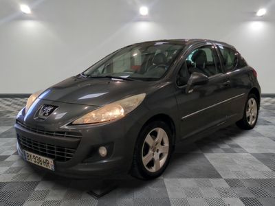 a picture of a grey car parked in a garage