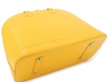 yellow leather suitcase on white background with clippings for handles