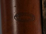 close up of a wooden object with a metal handle on a table