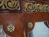 a wooden table with a mirror on top of it