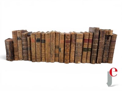 a lot of old books stacked on top of each other
