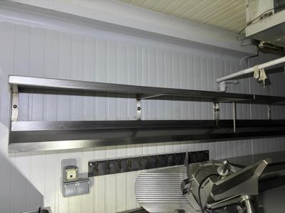 an image of a commercial kitchen with a lot of counter space