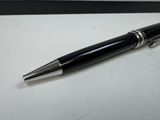 a pen that is laying on a table