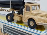 a toy truck that is sitting on top of a box