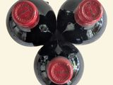 three bottles of wine sitting next to each other on a table