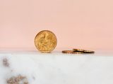 a gold coin sitting on top of a marble counter