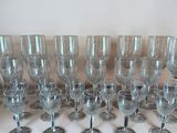 a lot of wine glasses sitting on a table