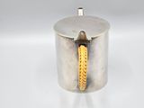 an image of a silver container with a yellow rope on it