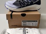 a pair of new balance shoes in a box on a table