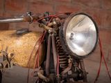 a close up of a motorcycle with a light on it ' s head