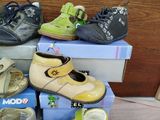 many pairs of shoes sitting on top of each other
