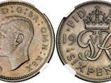 a close up of a coin with a crown on it