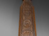 an old wooden spoon with a decorative design on it