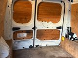 an image of a van with wood paneling in the back of it
