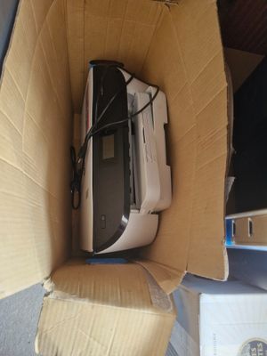 a box with a computer inside of it on the floor