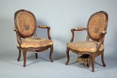 pair of louis xvi style carved walnut armchairs with upholstered upholstered seats