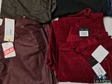 a lot of clothes that are sitting on a table