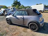 an image of a small car parked in a lot