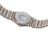 a close up of a watch on a white surface with a white background