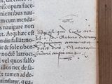 an old book with writing on it on a table