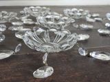 a lot of crystal glass pieces on a wooden table