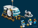 a lego set with a truck and a boat in the background