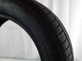 a close up of a tire on a white surface