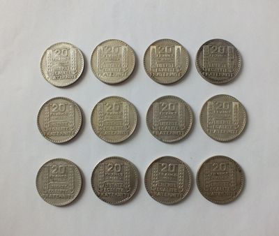 a close up of a bunch of coins sitting on top of a table