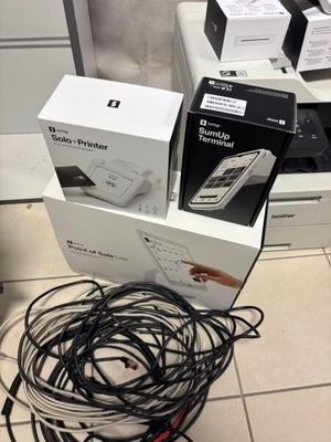 a pile of wires on the floor next to a box
