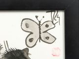 a picture of a picture of a cat and a butterfly