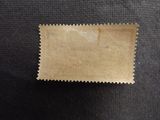 a piece of brown paper sitting on top of a black surface