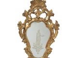 a gold frame with a picture of a woman on it