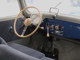 a steering wheel and dashboard of an old car